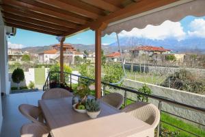 a view from the balcony of a house with a table and chairs at Lana's House in Berat