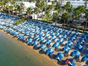 an aerial view of a beach with chairs and umbrellas at Nagi Beach Hotel in Gümbet