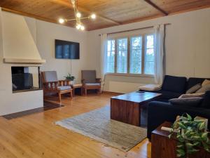 a living room with a couch and a table at The River House & Riverside Sauna in Kokkola +50 photos
