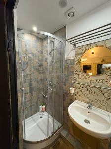 a bathroom with a shower and a sink at Villa Romana in Bucharest +60 photos