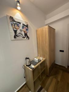 a room with a wooden cabinet and a telephone at Villa Romana in Bucharest