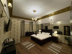a bedroom with a bed and a large mirror at Villa Romana in Bucharest