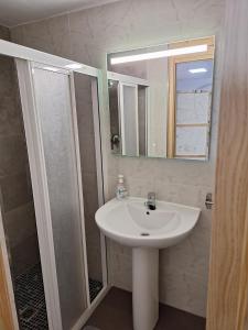 a bathroom with a sink and a mirror at Casa Rural SERAGAL in El Bonillo +41 photos