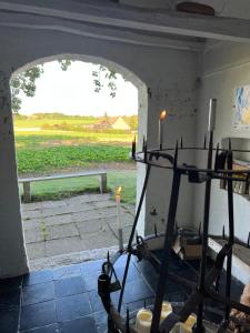 a room with a view of a field with candles at Ons Heerens Boompje in Poperinge +34 photos