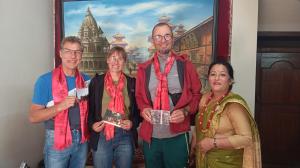 a group of people standing in front of a painting at Lalit Heritage Home in Pātan