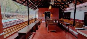 a row of benches in a baseball stadium at Srikadhama in Udupi