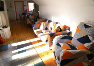 a living room with two couches and a table at Villa vague bleue Blankenberge in Blankenberge