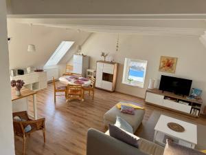 a living room with a couch and a table at Ferienwohnung Storchennest Vipperow in Ludorf
