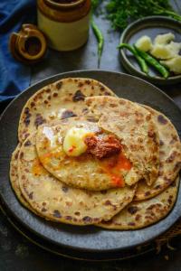 two pancakes on a plate on a table at Maheshwari international in Lansdowne