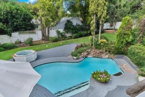 an overhead view of a swimming pool in a yard at Jewel On Juweel in Four Ways