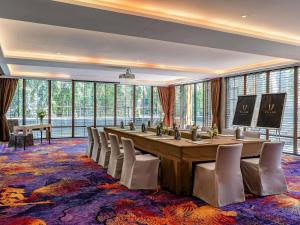 a large conference room with a long table and chairs at V Villas Hua Hin - MGallery Collection in Hua Hin +173 photos