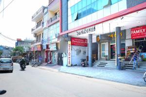 a street with a building with motorcycles parked on the street at Hotel The Bliss Near Housing Board Chowk Mani Majra Chandigarh in Chandīgarh