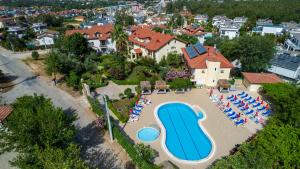 an aerial view of a swimming pool at a resort at Gokcen Hotel & Apartments in Oludeniz