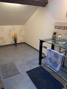 a room with a glass table and a tile floor at Thunder Roadhouse in La Mothe-Saint-Héray +33 photos