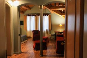 a room with a bed and a table and chairs at The Tower in Torreglia