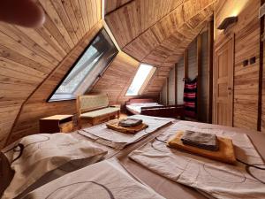 a large bed in a wooden room with a window at The Forest Sea Dome in Varna City +31 photos