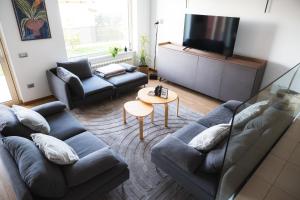 a living room with a couch and a table at Villa Leo in Koper