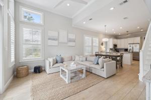a living room with a couch and a table at Sweet Bay on 30A in Seagrove Beach