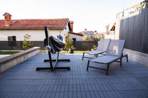 two chairs sitting on top of a roof at Villa Leo in Koper