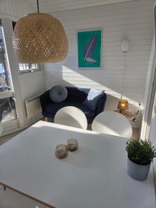 a living room with a couch and a table at Riis Feriepark in Give +14 photos