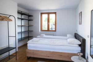 a bedroom with two beds and a shelf at Villa Leo in Koper