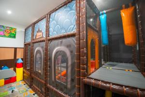 a train themed play room with a train on the wall at Relax hotel FIM in Belá