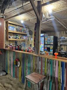 a room with a wooden counter and a bench at Homestay JB Sơn Hải in Thôn Sơn Hải +15 photos
