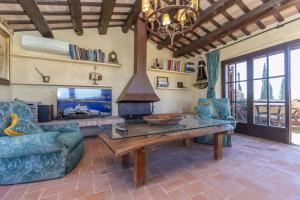 a living room with a table and a fireplace at Balco de l' Empordà in Corçà