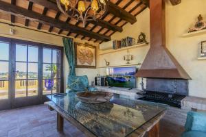 a kitchen with a large stove and a table at Balco de l' Empordà in Corçà