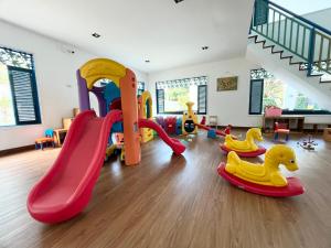 a play room with a slide and play equipment at My Resort Condo in Hua Hin E204 in Hua Hin