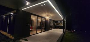 a hallway of a house at night with lights at Casa Quinta El Rodeo in La Plata +6 photos