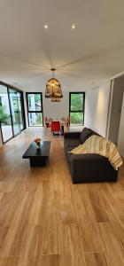 a living room with a couch and a table at Casa Quinta El Rodeo in La Plata