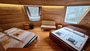 an overhead view of a bedroom with two beds and a chair at The Forest Sea Dome in Varna City