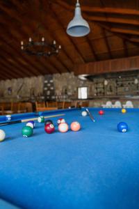 a pool table with balls and cues on it at Gokcen Hotel & Apartments in Oludeniz