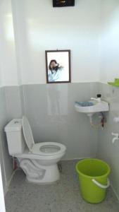 a bathroom with a toilet and a sink at Scott Camotes Beach House in San Francisco +61 photos