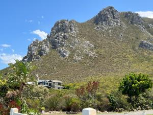 a house on the side of a mountain at Mountain View Studio Hermanus in Hermanus