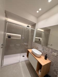 a bathroom with a shower and a toilet and a sink at Da Nella 1 in Ancona +21 photos