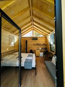 a bedroom with a bed and a desk in a room at Garden rooms in Kutaisi in Kutaisi