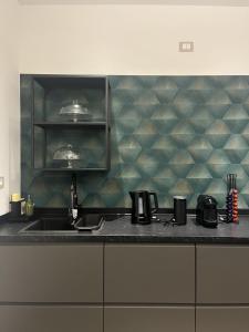 a kitchen with a sink and a counter top at Domus Europa in Matera +22 photos
