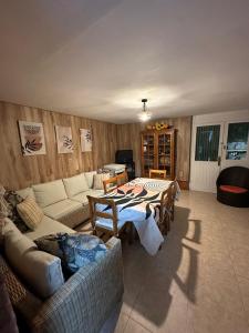 a living room with a couch and a table at Casa en Laredo in Laredo