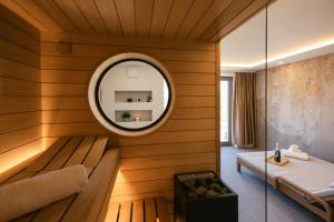 a room with a bed and a mirror in a room at Villa Diona in Loka pri Žusmu