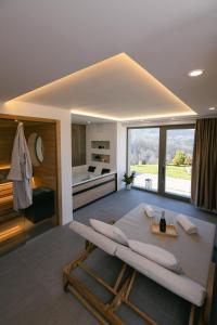 a living room with a bed and a kitchen at Villa Diona in Loka pri Žusmu