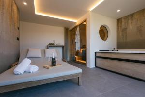 a bedroom with a bed with a bottle of wine on it at Villa Diona in Loka pri Žusmu