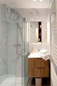 a bathroom with a shower and a sink at Suite Aux Anges in Antwerp +80 photos