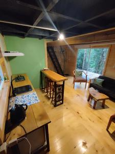 a large room with a kitchen and a living room at Refugió Chaicura in Chonchi