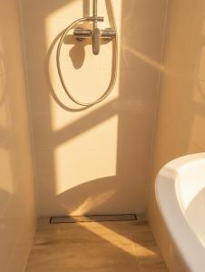 a bathroom with a toilet and a sink at Hotel Sickinger Hof in Berlin