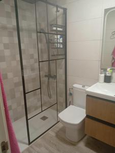 a bathroom with a shower with a toilet and a sink at Apartamento la romanilla a 200metros de la playa in Roquetas de Mar