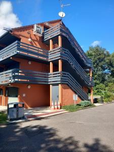 a large building with stairs on the side of it at Campanile NATURE -Haguenau in Haguenau