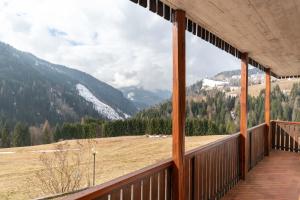 a balcony with a view of a mountain at Condominio Meraviglia in Selva di Cadore