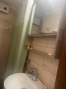 a bathroom with a sink and a mirror at Πολύμνια in Agia Anna +71 photos